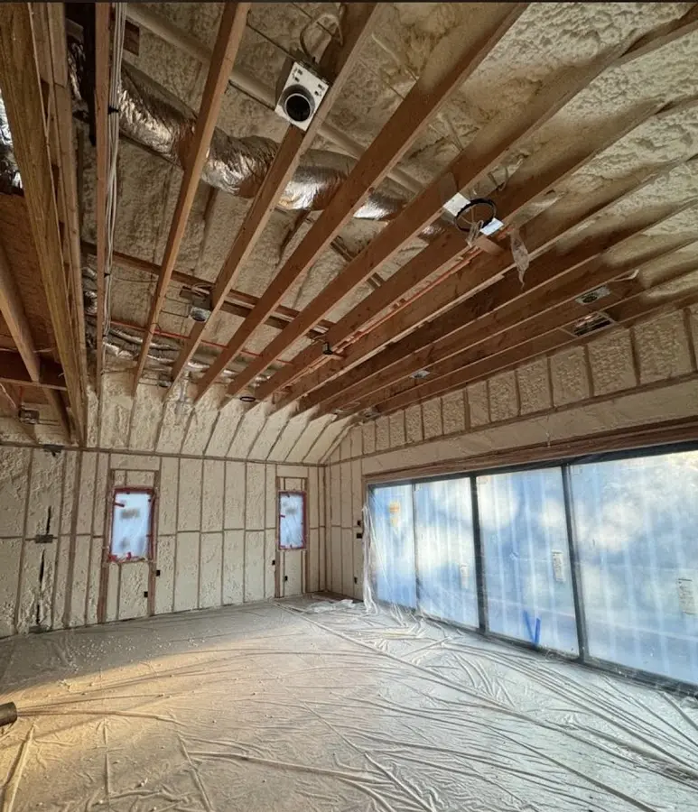 Interior walls and ceiling insulated with spray foam during new construction in Urbana